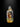 Glass bottle with a small figure inside on a black background