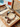 Bracelet with decorative elements in a wooden jewelry box