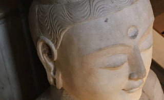 The Artistry of Serenity: Unraveling the Expression of Stone Buddha