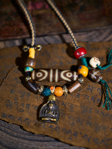 Flowing Fortune Water-Pattern Eight-Eyed Agate Dzi Pendant