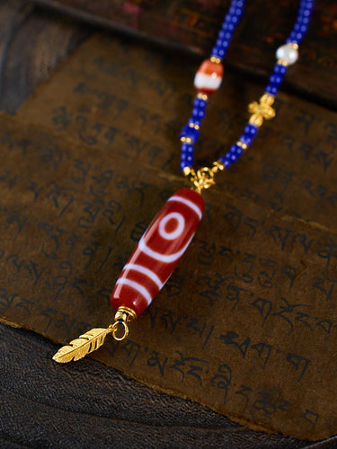 Dual Blessings of Wealth & Harmony – Two-Eyed Cinnabar Dzi Bead Lapis Lazuli Necklace