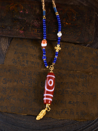 Dual Blessings of Wealth & Harmony – Two-Eyed Cinnabar Dzi Bead Lapis Lazuli Necklace