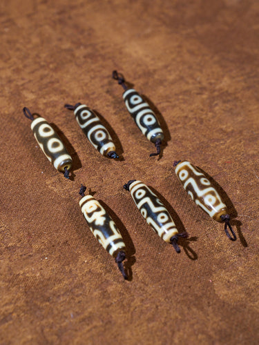 Ninefold Convergence · One-of-a-Kind Nine-Eyed Dzi Bead