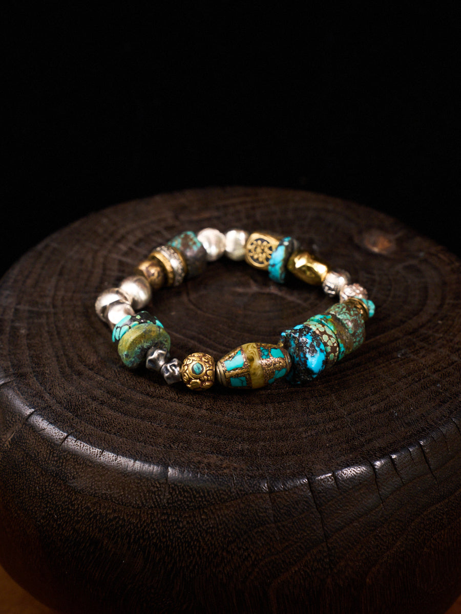 Multicolored beaded bracelet on a dark textured surface