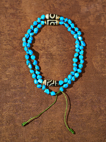 Twin Eye Destiny Thread · Two-Eyed Dzi Necklace