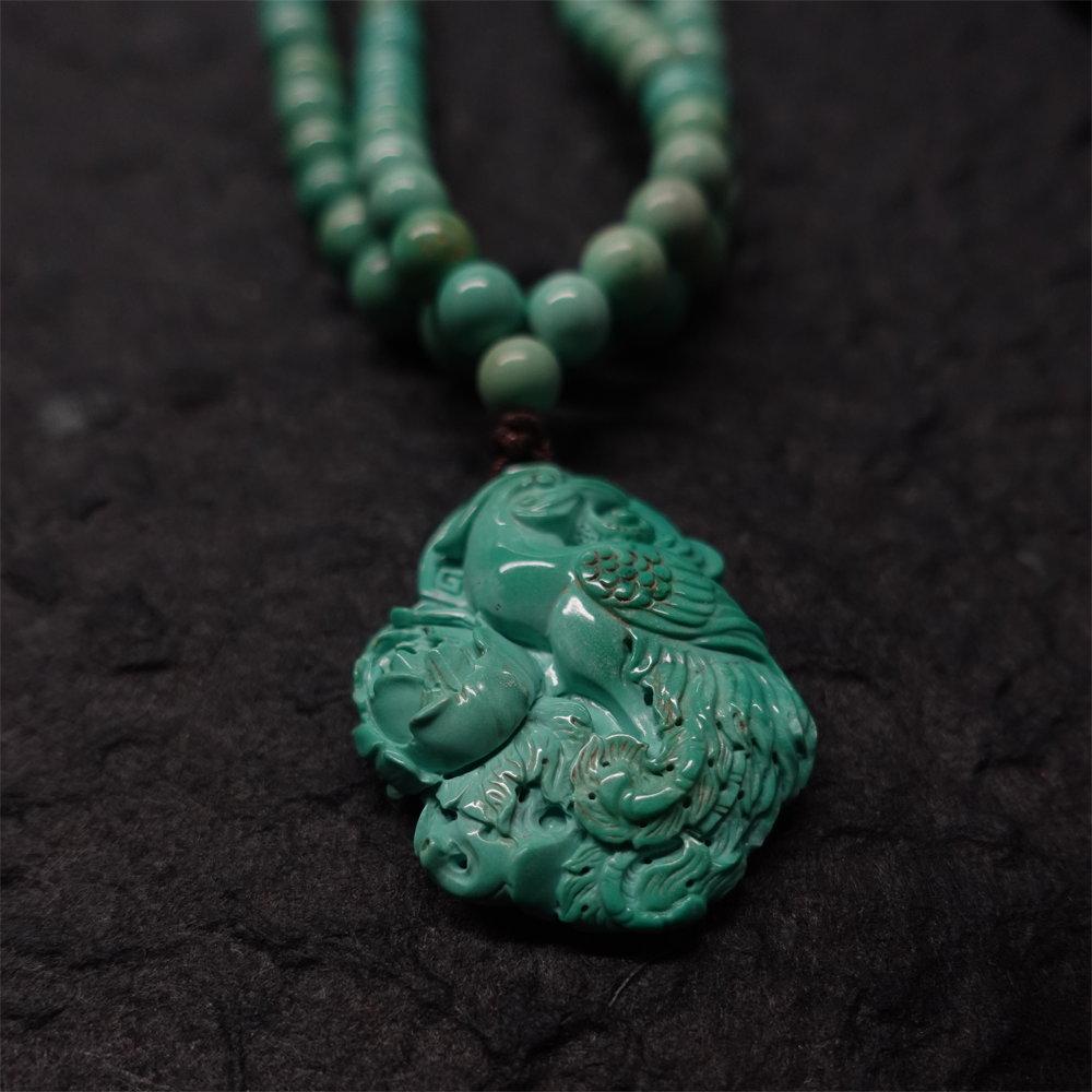 "Phoenix Energy Turquoise Necklace with Hand-Carved Tibetan Craftsmanship"