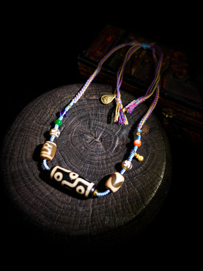 Necklace with beads on a dark surface