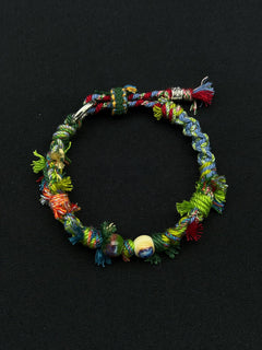 Colorful braided bracelet on a black background