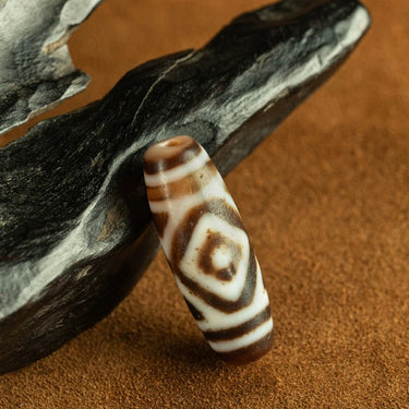 Tibetan Hollow Tiger-Tooth Double Vajra-Eye Central-Eye Dzi Bead from Tibet