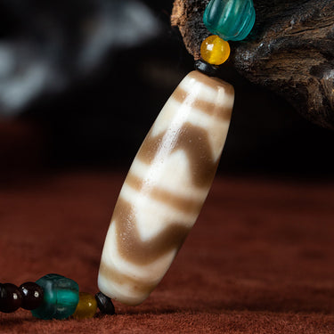 Nine-Eye Tiger Tooth Dzi Pendant – Courage Energy and Spiritual Empowerment