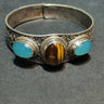 Tranquil Strength Bracelet | Pure Silver Bangle with Aquamarine and Tiger Eye for Calm and Protection - Kailash Energy