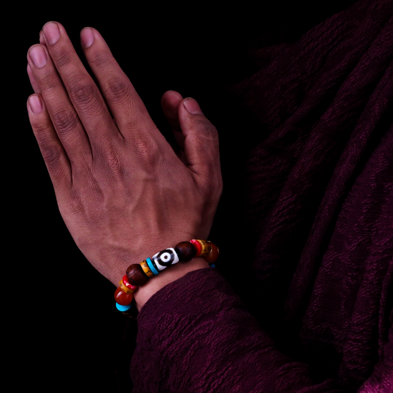 The Tibetan King's Spiritual Practice Three-Eyed Dzi Bead Bracelet & The Eye of the Summit Tibetan Red Cracked Pattern Dzi Bead puretibetan